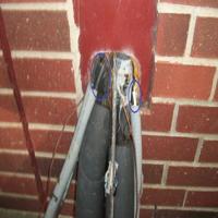 Exposed wiring/voids in conduit at A/C electrical found during home inspection in North Houston 