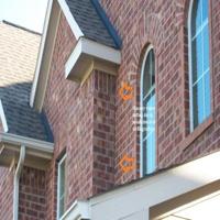 Brick installed over roof decking/rafters, irregular settling observed during home inspection in Spring, TX 
